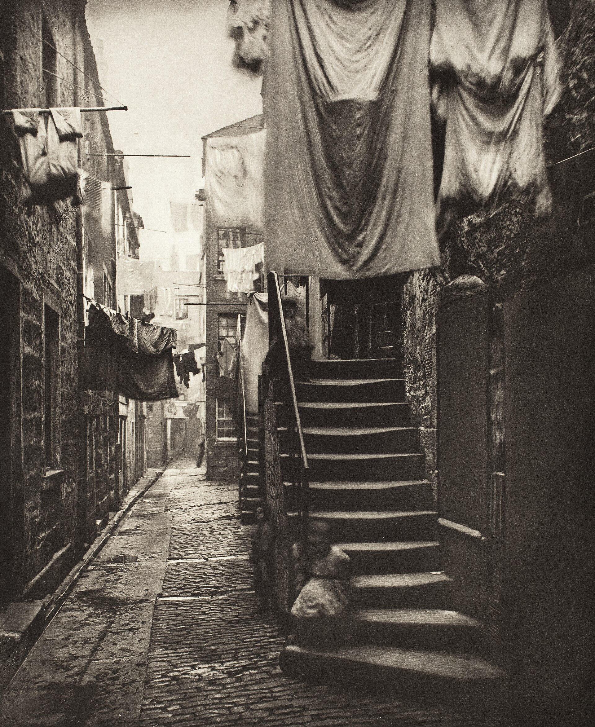 A narrow Glasgow close photographed by Thomas Annan in 1868